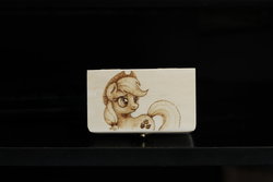 Size: 1280x853 | Tagged: safe, artist:horseez, applejack, earth pony, pony, g4, box, female, looking back, mare, pyrography, solo, traditional art