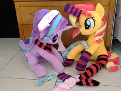 Size: 1024x768 | Tagged: safe, artist:nekokevin, starlight glimmer, sunset shimmer, pony, unicorn, series:nekokevin's glimmy, g4, clothes, cute, duo, female, glimmerbetes, horn, horn sock, irl, looking down, mare, photo, plushie, shimmerbetes, sitting, smiling, socks, striped socks