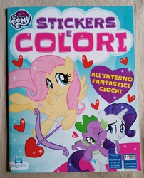 Size: 2902x3589 | Tagged: safe, fluttershy, rarity, spike, g4, official, arrow, bolt, bow (weapon), coloring book, cupid, female, fluttershipper, heart, heart arrow, high res, hug, hug from behind, irl, italian, italian coloring book, italy, magazine, magazine cover, male, photo, ship:sparity, shipper on deck, shipping, straight