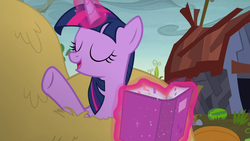 Size: 1280x720 | Tagged: safe, screencap, twilight sparkle, alicorn, pony, g4, the hooffields and mccolts, book, female, hay, magic, solo, twilight sparkle (alicorn)