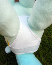 Size: 958x1200 | Tagged: safe, artist:hoppip, lyra heartstrings, pony, unicorn, g4, butt, close-up, clothes, female, infamous, irl, legs in air, lying, lyra plushie, mare, on back, outdoors, panties, photo, plot, plothole plush lyra, plushie, rear view, solo, underwear