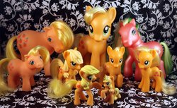 Size: 2712x1656 | Tagged: safe, applejack, applejack (g1), applejack (g3), baby applejack, g1, g3, g4, generational ponidox, irl, jackletree, multeity, photo, toy