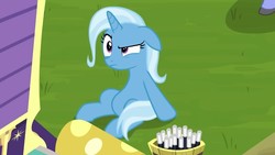 Size: 1280x720 | Tagged: safe, screencap, hoo'far, trixie, pony, unicorn, g4, road to friendship, annoyed, belly, female, floppy ears, mare, sitting, solo, trixie's wagon