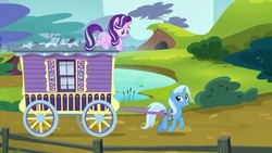 Size: 1280x720 | Tagged: safe, screencap, starlight glimmer, trixie, pony, unicorn, g4, my little pony: friendship is magic, road to friendship, duo, duo female, female, looking at each other, mare, prone, trixie's wagon, wagon