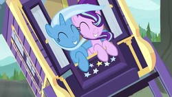 Size: 1280x720 | Tagged: safe, screencap, starlight glimmer, trixie, pony, unicorn, g4, road to friendship, ^^, duo, duo female, eyes closed, female, hug, mare, smiling, trixie's wagon