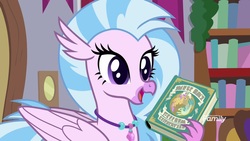 Size: 1920x1080 | Tagged: safe, screencap, silverstream, hippogriff, g4, the hearth's warming club, book, bookshelf, discovery family, discovery family logo, female, jewelry, logo, necklace, open beak, solo, written equestrian