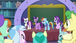 Size: 1920x1080 | Tagged: safe, screencap, huckleberry, ocellus, peppermint goldylinks, rainbow dash, rarity, sandbar, silverstream, starlight glimmer, twilight sparkle, alicorn, pegasus, pony, unicorn, g4, the end in friend, camping outfit, chalkboard, clothes, dress, female, friendship student, jersey, male, mare, mouth hold, notepad, pencil, school of friendship, shirt, stage, stallion, twilight sparkle (alicorn)