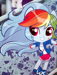 Size: 972x1296 | Tagged: safe, artist:amy mebberson, rainbow dash, equestria girls, g4, official, chibi, clothes, doll, equestria girls minis, female, grin, hasbro, merchandise, pants, photo, poster, smiling, toy