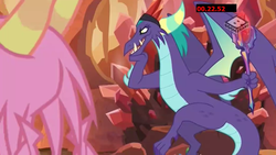 Size: 1024x576 | Tagged: safe, screencap, gaius, scales (g4), dragon, g4, the hearth's warming club, bloodstone scepter, boomerang (tv channel), dragon crown, dragon lord, male, throne, throne slouch, trap