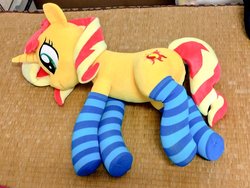 Size: 1024x768 | Tagged: safe, artist:nekokevin, sunset shimmer, pony, unicorn, g4, clothes, cute, female, irl, lying down, mare, photo, plushie, smiling, socks, solo, striped socks