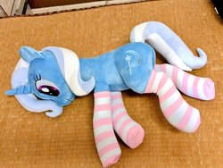 Size: 1024x768 | Tagged: safe, artist:nekokevin, trixie, pony, unicorn, g4, clothes, cute, female, irl, lying down, mare, photo, plushie, smiling, socks, solo, striped socks