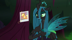 Size: 1280x720 | Tagged: safe, screencap, applejack, queen chrysalis, changeling, changeling queen, g4, the mean 6, female, hair, hoof on chest, photo, picture, solo, tree
