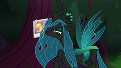 Size: 1280x720 | Tagged: safe, screencap, applejack, queen chrysalis, changeling, changeling queen, pony, g4, the mean 6, female, hair, nose wrinkle, photo, picture, side view, solo, tree
