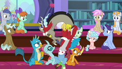Size: 1280x720 | Tagged: safe, screencap, clever musings, cozy glow, discord, gallus, november rain, ocellus, peppermint goldylinks, slate sentiments, smolder, strawberry scoop, summer meadow, violet twirl, changedling, changeling, draconequus, dragon, griffon, pegasus, pony, a matter of principals, g4, season 8, 30 rock, background pony, baseball cap, bow, cap, dragoness, female, filly, friendship student, hair bow, hat, how do you do fellow kids, male, open mouth, pointing, san diego comic con, school of friendship, sdcc 2018, sitting, steve buscemi, tail bow