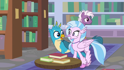 Size: 1280x720 | Tagged: safe, screencap, gallus, silverstream, classical hippogriff, griffon, hippogriff, pony, a matter of principals, g4, book, bookshelf, female, grin, jewelry, male, necklace, shipping fuel, smiling