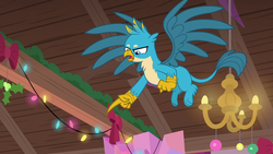 Size: 1280x720 | Tagged: safe, screencap, gallus, griffon, g4, the hearth's warming club, claws, flying, male, paws, pointing, solo, wings