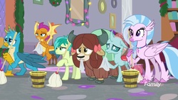 Size: 1920x1080 | Tagged: safe, screencap, gallus, ocellus, sandbar, silverstream, smolder, yona, changedling, changeling, classical hippogriff, dragon, earth pony, griffon, hippogriff, pony, yak, g4, the hearth's warming club, bow, bucket, cloven hooves, discovery family, discovery family logo, dragoness, female, flying, hair bow, hoof hold, jewelry, logo, male, monkey swings, mop, mouth hold, necklace, student six, teenager