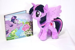 Size: 3000x2000 | Tagged: safe, artist:nekokevin, twilight sparkle, alicorn, pony, g4, the art of equestria, book, cutie mark, female, high res, irl, mare, photo, plushie, simple background, smiling, solo, spread wings, twilight sparkle (alicorn), watermark, white background, wings