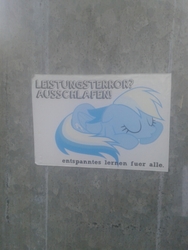 Size: 720x960 | Tagged: safe, rainbow dash, g4, german, irl, photo, pole, sleeping, sticker