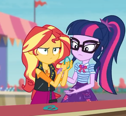 Size: 587x540 | Tagged: safe, screencap, sci-twi, sunset shimmer, twilight sparkle, equestria girls, equestria girls specials, g4, my little pony equestria girls: better together, my little pony equestria girls: rollercoaster of friendship, clothes, cropped, female, geode of empathy, geode of telekinesis, glasses, jacket, leather jacket, ponytail, shirt, shrunken pupils, skirt