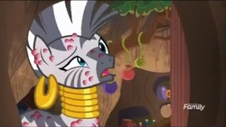 Size: 1037x585 | Tagged: safe, screencap, zecora, zebra, a rockhoof and a hard place, g4, season 8, bee sting, ear piercing, earring, female, jewelry, mare, neck rings, open mouth, pain, piercing, raised eyebrow, solo, why