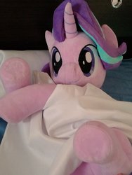 Size: 768x1024 | Tagged: safe, artist:nekokevin, starlight glimmer, pony, unicorn, series:nekokevin's glimmy, g4, bed, blanket, close-up, female, irl, looking at you, lying down, mare, photo, pillow, plushie, smiling, solo, underhoof