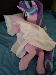 Size: 768x1024 | Tagged: safe, artist:nekokevin, starlight glimmer, pony, unicorn, series:nekokevin's glimmy, g4, bed, blanket, female, irl, lying down, mare, photo, pillow, plushie, smiling, solo, underhoof