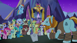 Size: 1280x720 | Tagged: safe, screencap, applejack, fluttershy, gallus, ocellus, pinkie pie, rainbow dash, rarity, rockhoof, sandbar, silverstream, smolder, spike, summer breeze, twilight sparkle, yona, alicorn, changedling, changeling, classical hippogriff, dragon, earth pony, griffon, hippogriff, pegasus, pony, yak, a rockhoof and a hard place, g4, audience, beard, bow, braid, clothes, cloven hooves, dragoness, facial hair, female, flying, hair bow, hair bun, jewelry, leg wraps, male, mane six, mare, monkey swings, moustache, necklace, rockhoof's shovel, shovel, stallion, student six, twilight sparkle (alicorn), wall of tags