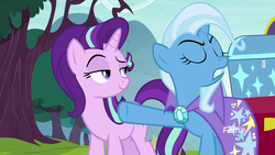 Size: 1920x1080 | Tagged: safe, screencap, starlight glimmer, trixie, pony, unicorn, g4, road to friendship, amused, cape, clothes, discovery family, discovery family logo, duo, female, logo, mare, raised eyebrow, smiling, smirk, trixie's cape