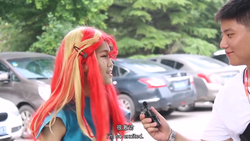 Size: 1280x720 | Tagged: safe, sunset shimmer, human, g4, car, china, china ponycon, clothes, cosplay, costume, irl, irl human, photo, wig