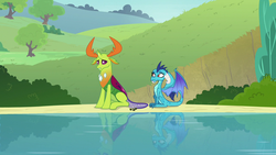 Size: 1280x720 | Tagged: safe, screencap, princess ember, thorax, changedling, changeling, dragon, g4, triple threat, behaving like a dog, changeling king, dragoness, duo, female, king thorax, male, pond, reflection, sitting, water