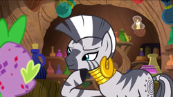 Size: 1136x640 | Tagged: safe, screencap, spike, zecora, zebra, g4, molt down, season 8, ear piercing, earring, female, jewelry, mare, molting, neck rings, piercing, stone scales, thinking