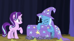 Size: 1920x1080 | Tagged: safe, screencap, starlight glimmer, trixie, pony, unicorn, g4, road to friendship, bipedal, cape, chains, chest, clothes, female, hat, mare, stage, trixie's cape, trixie's hat