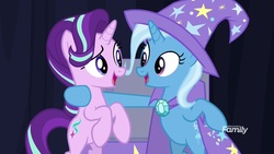 Size: 1920x1080 | Tagged: safe, screencap, starlight glimmer, trixie, pony, unicorn, g4, road to friendship, bipedal, bipedal leaning, cape, clothes, duo, eye contact, female, hat, leaning, looking at each other, mare, trixie's cape, trixie's hat