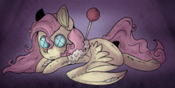 Size: 1280x652 | Tagged: safe, artist:urbanqhoul, fluttershy, pony, g4, button eyes, doll, female, pin, prone, solo, spread wings, stray strand, voodoo doll, wings
