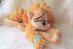 Size: 5472x3648 | Tagged: safe, artist:kazzysart, pear butter, earth pony, pony, g4, beanie (plushie), female, freckles, irl, lidded eyes, mare, photo, plushie, prone, solo