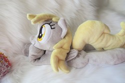 Size: 5472x3648 | Tagged: safe, artist:kazzysart, derpy hooves, pegasus, pony, g4, beanie (plushie), female, folded wings, irl, mare, photo, plushie, prone, solo, wings