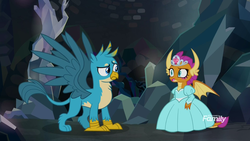Size: 1920x1080 | Tagged: safe, screencap, gallus, smolder, dragon, griffon, g4, what lies beneath, clothes, context is for the weak, discovery family, discovery family logo, dragoness, dress, duo, female, girly, gown, jewelry, lipstick, logo, male, nightmare cave, princess outfit, princess smolder, tiara, uhh i can explain