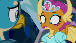 Size: 1280x720 | Tagged: safe, screencap, gallus, smolder, dragon, griffon, g4, what lies beneath, clothes, discovery family logo, dragoness, dress, eyes closed, female, jewelry, lipstick, makeup, male, out of context, princess smolder, puffy sleeves, tiara