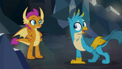 Size: 1280x720 | Tagged: safe, screencap, gallus, smolder, dragon, griffon, g4, what lies beneath, cave, cute, dragoness, female, gallabetes, male, paws, smiling, smolderbetes, wings