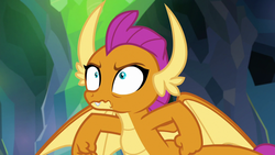 Size: 1280x720 | Tagged: safe, screencap, smolder, dragon, g4, my little pony: friendship is magic, what lies beneath, claws, dragon wings, dragoness, embarrassed, fangs, female, solo, spread wings, wavy mouth, wings