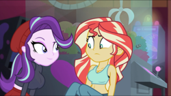 Size: 1920x1080 | Tagged: safe, edit, edited screencap, screencap, starlight glimmer, sunset shimmer, equestria girls, equestria girls specials, g4, my little pony equestria girls: mirror magic, beanie, big breasts, breast edit, breasts, busty starlight glimmer, busty sunset shimmer, cleavage, clothes, female, hat, midriff, raised eyebrow, sports bra