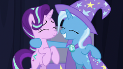 Size: 1280x720 | Tagged: safe, screencap, starlight glimmer, trixie, pony, unicorn, g4, road to friendship, bipedal, chest, duo, eyes closed, female, mare, rearing, smiling, stage