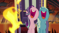 Size: 1280x720 | Tagged: safe, screencap, starlight glimmer, trixie, pony, unicorn, g4, road to friendship, duo, female, fire swamp, flame geyser, mare, mawshot, nose in the air, open mouth, singing, swamp, trixie's wagon, uvula, volumetric mouth