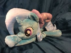 Size: 1200x900 | Tagged: dead source, safe, artist:sophie scruggs, trixie, pony, unicorn, g4, clothes, female, hat, irl, lying down, mare, photo, plushie, smiling, solo, trixie's hat