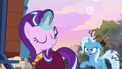 Size: 1920x1080 | Tagged: safe, screencap, starlight glimmer, trixie, pony, unicorn, g4, road to friendship, clothes, discovery family logo, duo, eyes closed, female, glowing horn, horn, magic, magic aura, mare, messy mane, robe, smiling