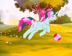 Size: 737x574 | Tagged: safe, screencap, fizzy, pony, twinkle eyed pony, unicorn, g1, my little pony: the movie (g1), ball, bow, cute, female, flower, jumping, smiling, solo, tail bow, tree