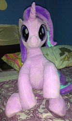 Size: 714x1200 | Tagged: safe, artist:nekokevin, starlight glimmer, pony, unicorn, series:nekokevin's glimmy, g4, bed, female, irl, looking at you, mare, photo, pillow, plushie, raised hoof, sitting, smiling, solo