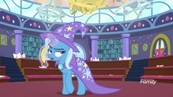Size: 1920x1080 | Tagged: safe, screencap, trixie, pony, unicorn, a matter of principals, g4, banana, bananaphone, cape, clothes, discovery family logo, female, food, glowing horn, hat, horn, magic, mare, solo, trixie is not amused, trixie's cape, trixie's hat, unamused