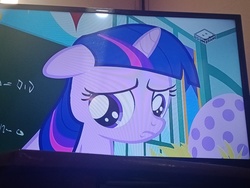 Size: 4160x3120 | Tagged: safe, screencap, twilight sparkle, pony, unicorn, g4, the cutie mark chronicles, boomerang (tv channel), cute, egg, female, filly, filly twilight sparkle, frown, irl, photo, picture of a screen, sad, twiabetes, younger
